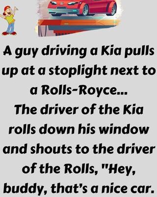 A guy driving a Kia pulls up at a stoplight